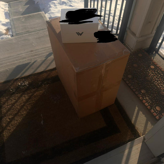 “Shipping box of a professional dual-module laser engraver featuring diode and infrared laser technology, photographed before unboxing.”